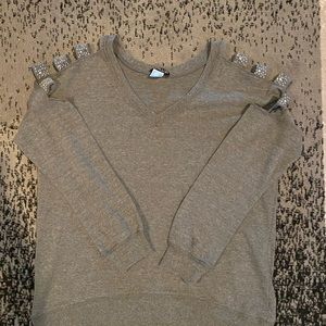 Beautiful gray cold shoulder top with bling. Worn once.
